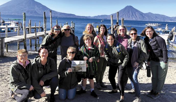 This group of intrepid travelers (standing, from left: Maryanne Groff, Diane Moratti, Lorraine Hoilien, Christine Devlin, Christine Hartranft, Eileen Hartranft, Ally Sticka; bottom, from left: Rosie Hymerling, Tobie Spears, Julia Ranson Mooney, Liam Mooney, Bekah Coffee) have made it to this lake, at over 5,000-foot elevation, which is surrounded by three volcanoes. As the deepest lake in Central America, plunging over 1,100 feet down, the waters from two rivers have filled the caldera over the last 10,000 
