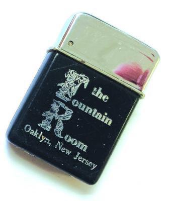 SPEAKING OF ASH TRAYS: This 1962 ad for the Fountain Room, in Oaklyn, includes a photo of a lighter and an ash tray, of course. Susan Buck has the same lighter, to the right. The “Ronsen” lighter to the left was a gift and is special to her because it was personalized with her initials. We bet Dave Cosky would like that ash tray! 