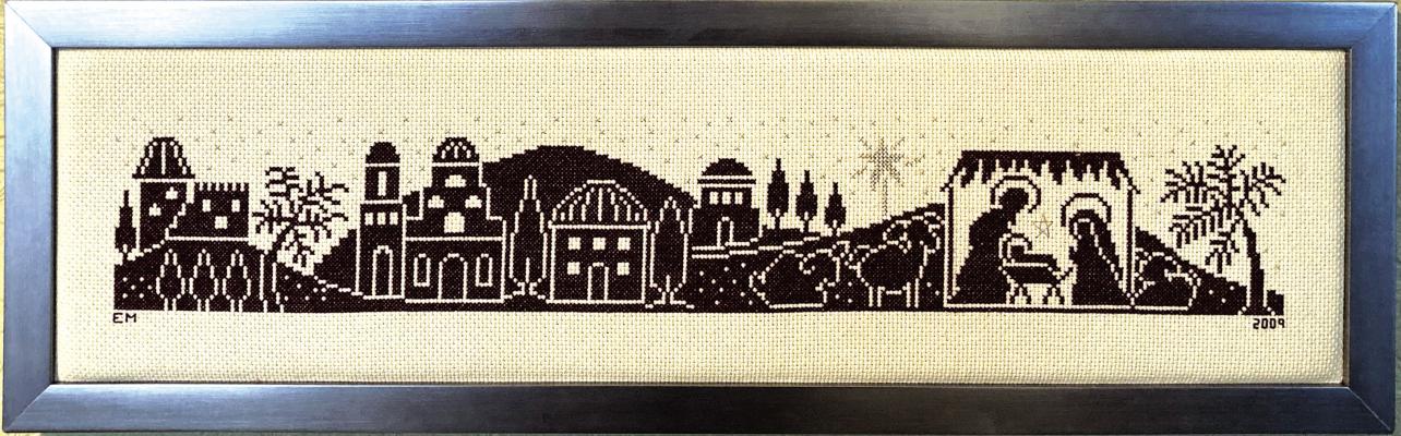 STITCHES IN TIME: Evelyn Miraglia made the cross stitched nativity scene in 2009 and displays it in her home during the holiday season. Inset below is one of Evelyn’s latest creations, an appliqué tea towel.